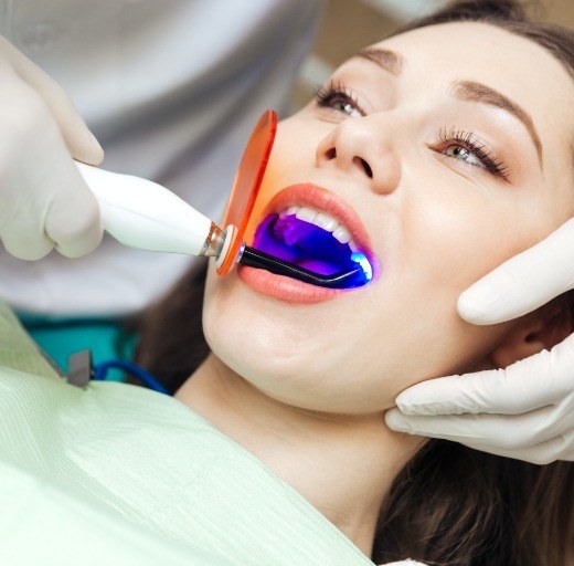 Woman receiving dental bonding