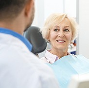 patient smiling while visiting dentist
