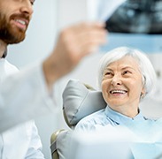 woman smiling while visiting dentist