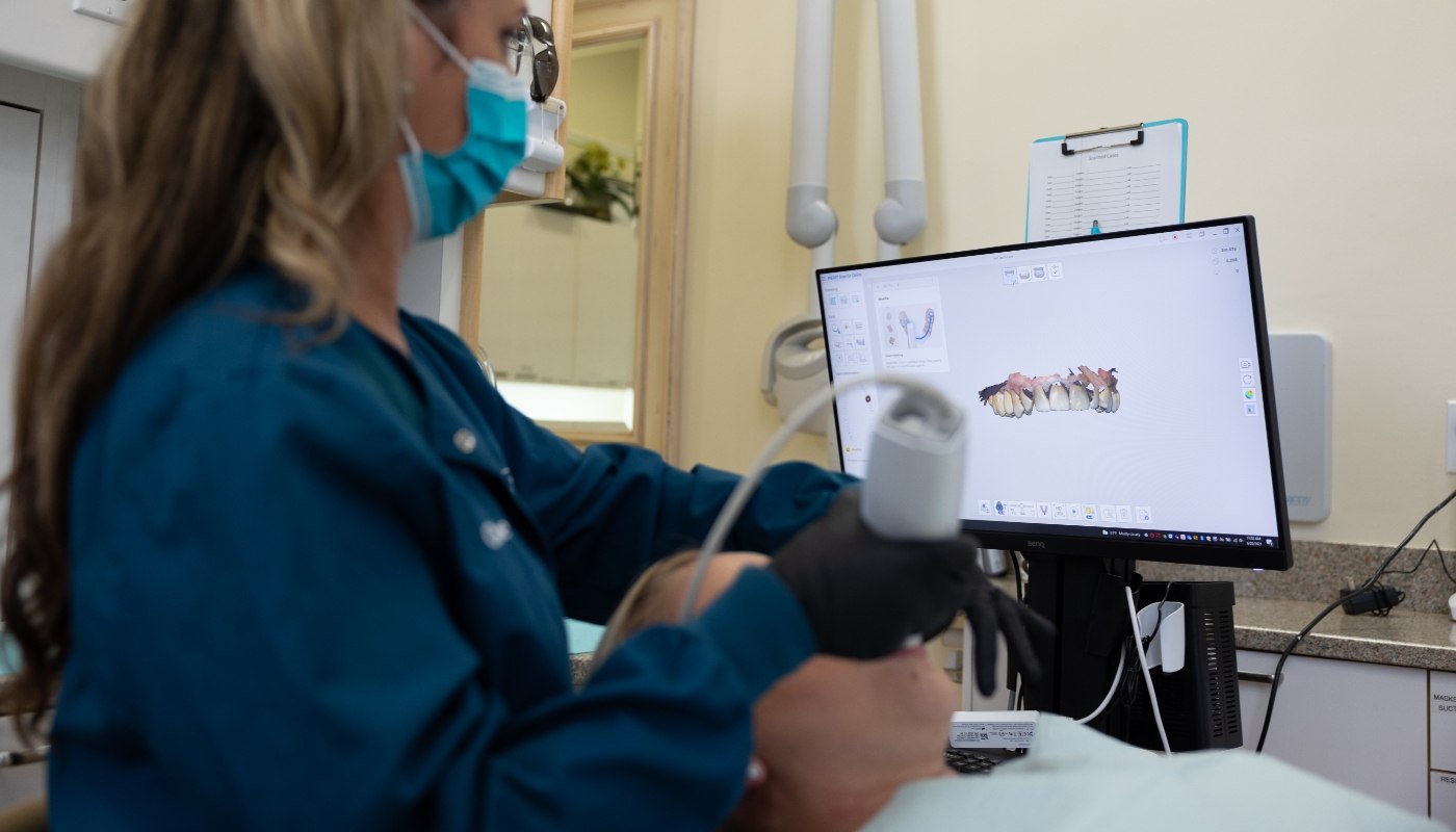 Estero dental team member capturing digital bite impressions of dental patient