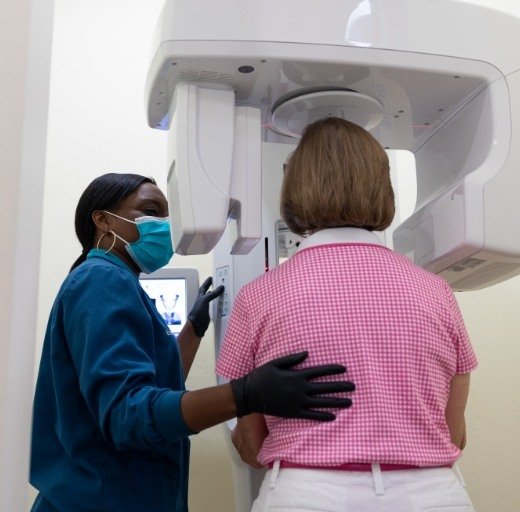 Dental patient receiving cone beam C T x-ray scans